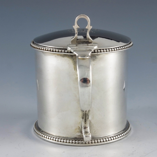 2024 - Thomas Daniel, London 1783, a George III silver straight sided cylindrical mustard pot with beaded b... 