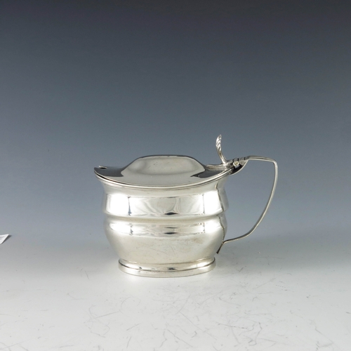 2027 - James Mince, London 1803, a George III oval silver mustard pot with moulded girdle and reeded form, ... 