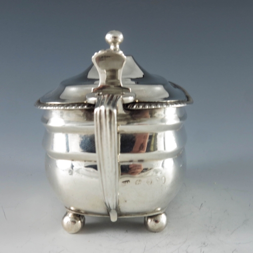 2030 - Solomon Hougham, London 1809, a George III silver mustard pot of rectangular moulded oval form, rais... 