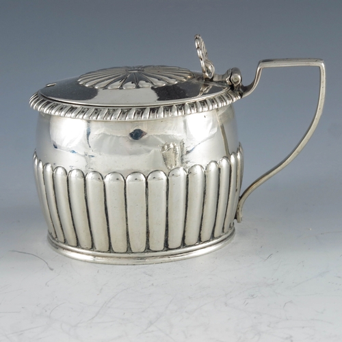 2031 - Rebecca  Emes and Edward Barnard, London 1817, a George III silver mustard pot, squat barrel form, h... 