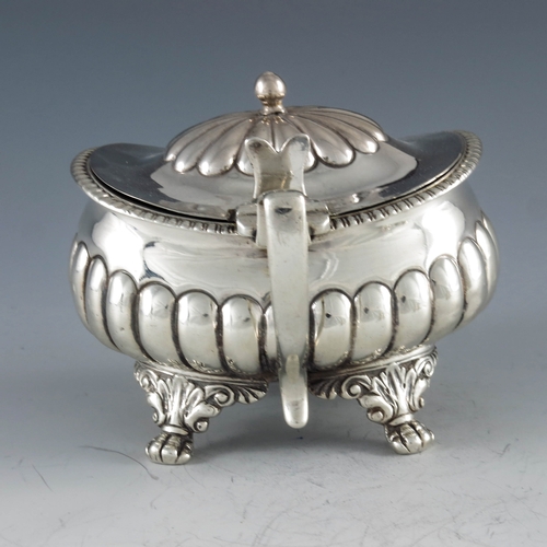 2032 - Stephen Adams, London 1818, a George III silver mustard pot, half reeded rectagular baluster form on... 