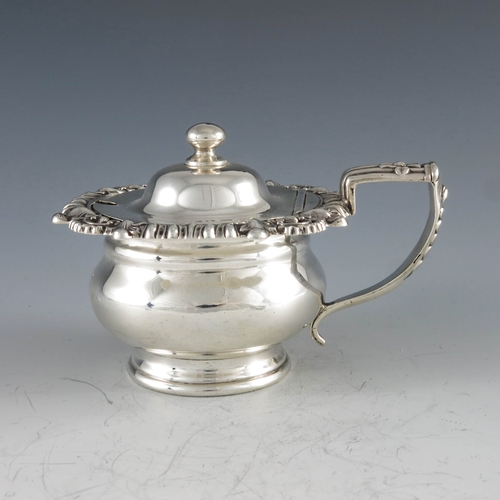 2033 - J Fenton, Sheffield 1820, a George III silver mustard pot, footed ogee moulded baluster form with wi... 