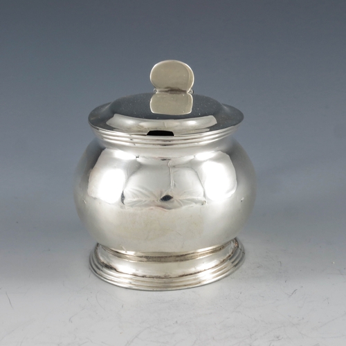 2038 - AK, London 1808, a George III silver barrel-shaped oval mustard pot of plain form with thread edged ... 