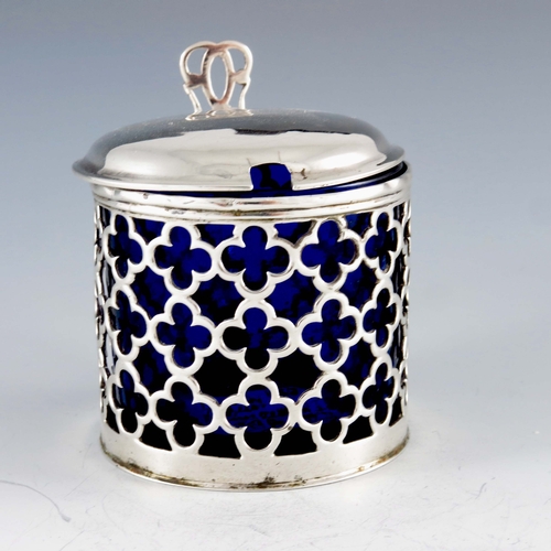 2041 - Charles Chesterman, London 1768, a George III silver mustard pot, reticulated cylindrical form, quat... 