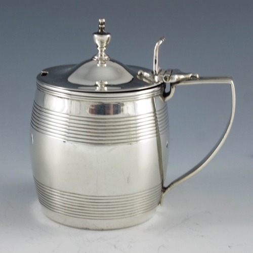 2043 - Stephen Adams, London 1805, a George III silver mustard pot of barrel form with reeded decoration, a... 