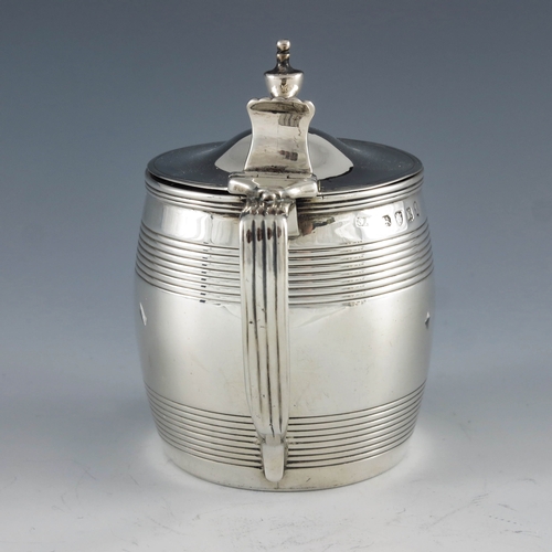 2043 - Stephen Adams, London 1805, a George III silver mustard pot of barrel form with reeded decoration, a... 