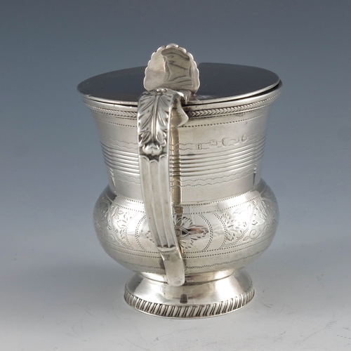 2044 - Naphtali Hart, London 1816, a George III silver mustard pot, footed bulbous beaker form with conical... 