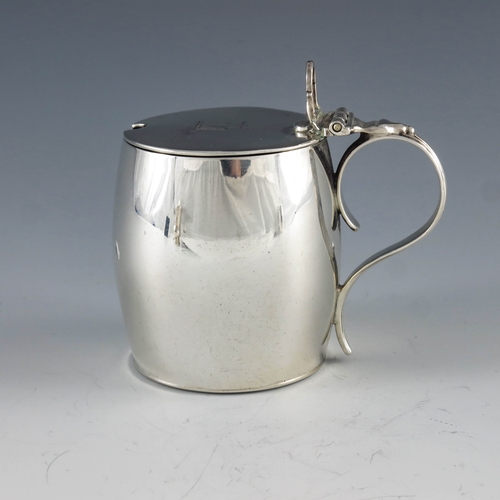 2045 - William Sumner I, London 1804, a George III silver mustard pot of plain barrel form with hinged lid,... 