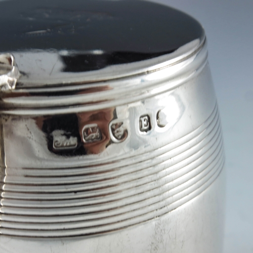 2046 - John Wren, London 1800, a George III silver mustard pot of barrell form with reeded decoration, hing... 