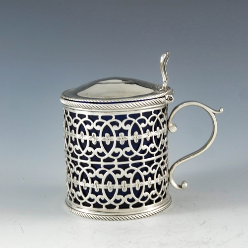 2048 - Thomas Nash, London 1773, a George III silver mustard pot, reticulated cylindrical form, two rows of... 