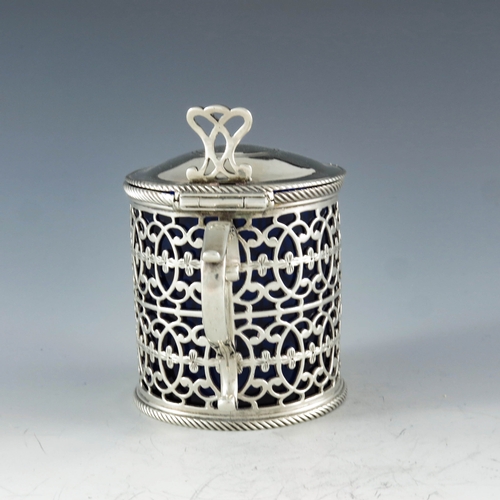 2048 - Thomas Nash, London 1773, a George III silver mustard pot, reticulated cylindrical form, two rows of... 