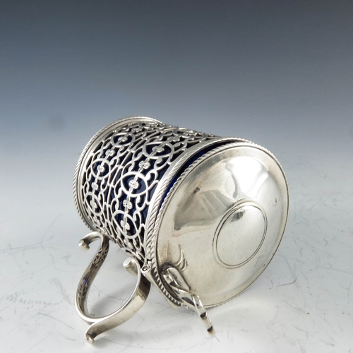 2048 - Thomas Nash, London 1773, a George III silver mustard pot, reticulated cylindrical form, two rows of... 