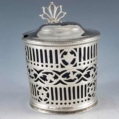 2051 - William Plummer, London 1780, a George III silver mustard pot, cylindrical form, bright cut and reti... 