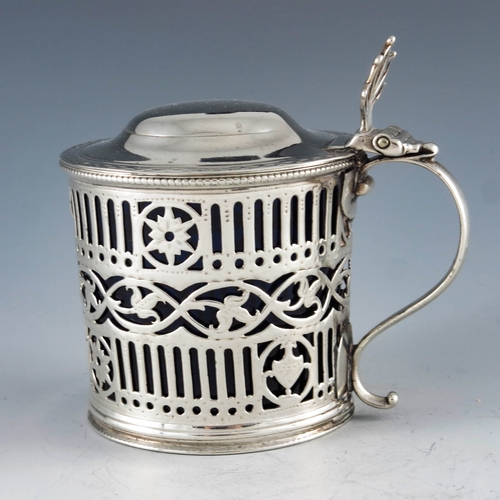 2051 - William Plummer, London 1780, a George III silver mustard pot, cylindrical form, bright cut and reti... 