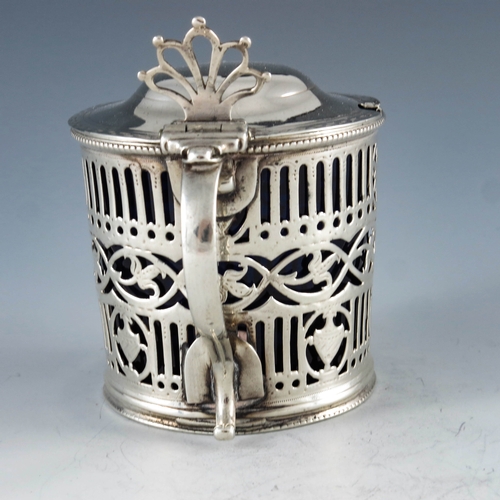 2051 - William Plummer, London 1780, a George III silver mustard pot, cylindrical form, bright cut and reti... 