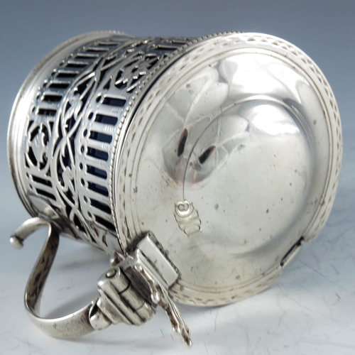 2051 - William Plummer, London 1780, a George III silver mustard pot, cylindrical form, bright cut and reti... 