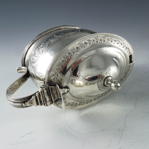 2053 - Abstinando King, London 1799, a George III silver mustard pot, bright cut oval ogee cylinder form, d... 