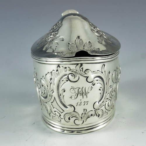 2057 - Samuel and Edward Davenport, London 1806, a George III silver mustard pot, oval boat form, embossed ... 