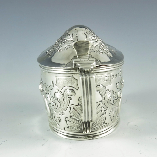 2057 - Samuel and Edward Davenport, London 1806, a George III silver mustard pot, oval boat form, embossed ... 