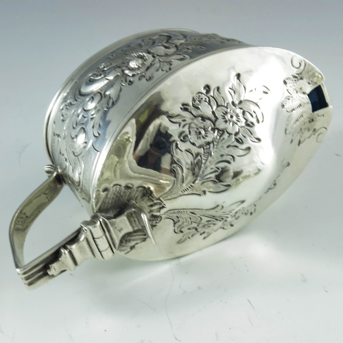 2057 - Samuel and Edward Davenport, London 1806, a George III silver mustard pot, oval boat form, embossed ... 