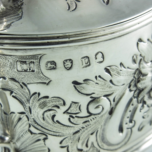 2057 - Samuel and Edward Davenport, London 1806, a George III silver mustard pot, oval boat form, embossed ... 