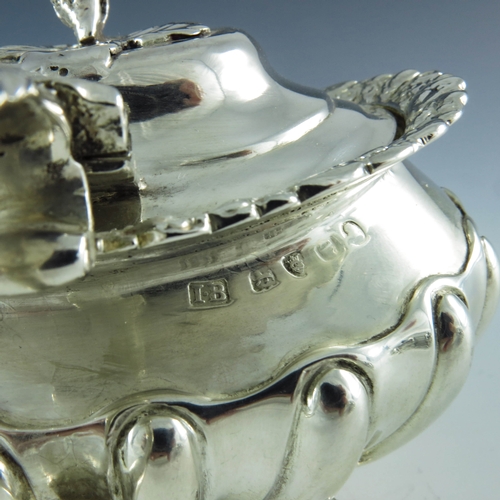 2059 - Joseph Biggs (attributed), London 1820, a George III silver mustard pot, ovoid shouldered form with ... 