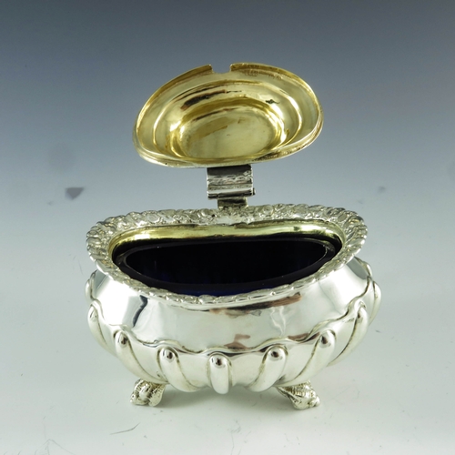 2059 - Joseph Biggs (attributed), London 1820, a George III silver mustard pot, ovoid shouldered form with ... 