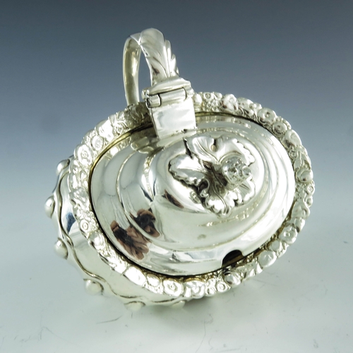 2059 - Joseph Biggs (attributed), London 1820, a George III silver mustard pot, ovoid shouldered form with ... 