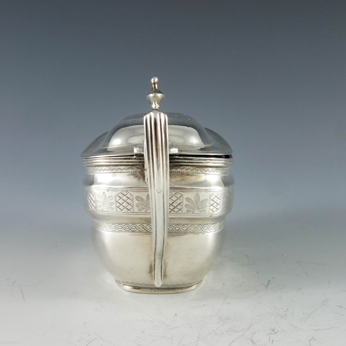 2068 - Charles Chesterman II, London 1807, a George III silver mustard pot, of oval navette form, bright cu... 