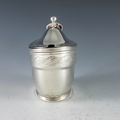 2071 - John Emes, London 1799, a George III silver mustard pot of oval navette form, the body with engraved... 