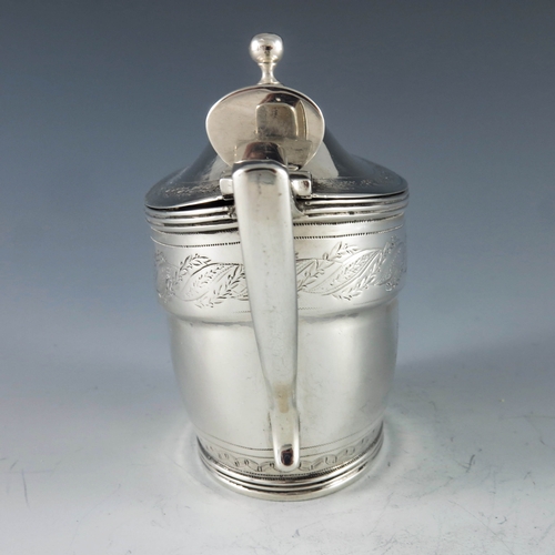 2071 - John Emes, London 1799, a George III silver mustard pot of oval navette form, the body with engraved... 