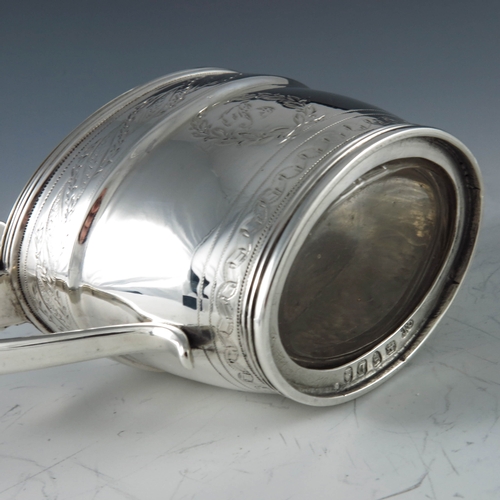 2071 - John Emes, London 1799, a George III silver mustard pot of oval navette form, the body with engraved... 