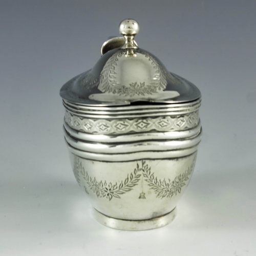 2073 - Abstainando King, London 1702, a George III silver mustard pot, bright cut oval navette form, decora... 