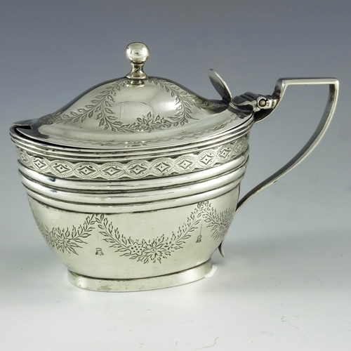 2073 - Abstainando King, London 1702, a George III silver mustard pot, bright cut oval navette form, decora... 