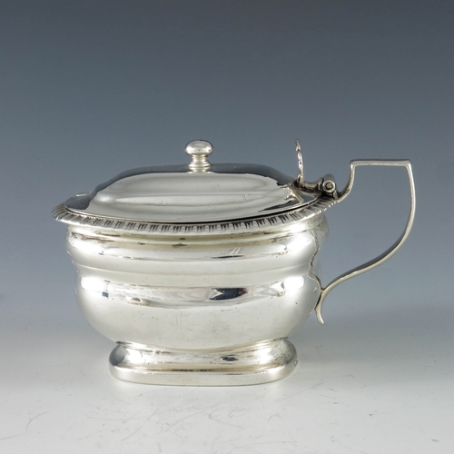 2078 - Rebecca Emes & Edward Barnard I, London 1810, a George III oval silver mustard pot with moulded gird... 