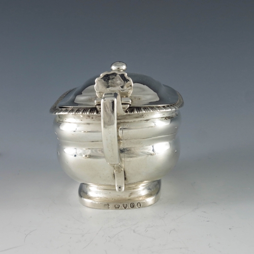 2078 - Rebecca Emes & Edward Barnard I, London 1810, a George III oval silver mustard pot with moulded gird... 