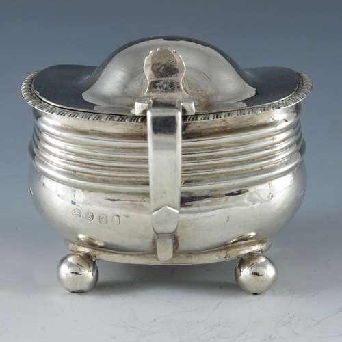 2080 - Unknown, London 1818, a George III silver mustard pot, rectangular ribbed baluster form, on four sph... 