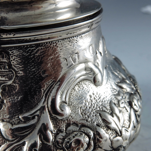 2082 - Rebecca Emes and Edward Barnard, London 1819, a George III silver mustard pot, bulbous form, embosse... 