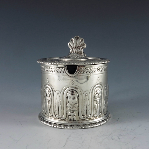 2084 - Eliza Godfrey, London 1762, a George III silver mustard pot of cylindrical form, heavily decorated w... 