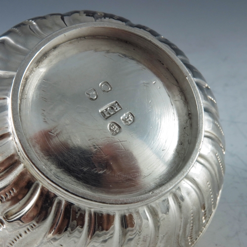 2085 - Robert Hennell II, London 1818, a George III silver mustard pot of circular compressed form, the bod... 