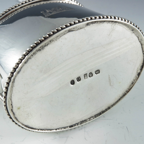 2093 - Edward Capper, London 1795, a George III silver mustard pot of plain oval form with beaded borders, ... 