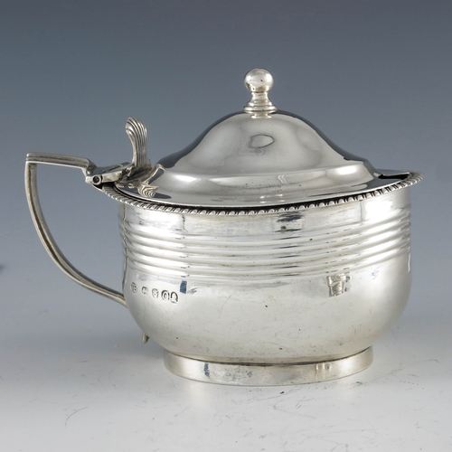 2094 - Crispin Fuller, London 1809, a George III oval silver mustard pot with moulded girdle and reeded dec... 