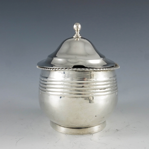 2094 - Crispin Fuller, London 1809, a George III oval silver mustard pot with moulded girdle and reeded dec... 