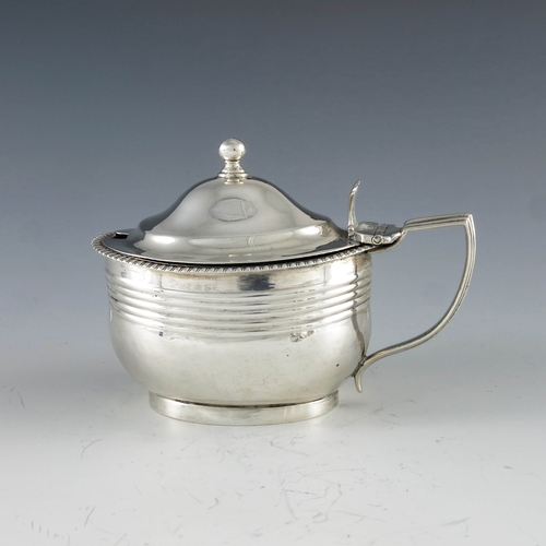 2094 - Crispin Fuller, London 1809, a George III oval silver mustard pot with moulded girdle and reeded dec... 