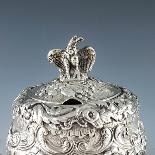 2102 - William Eaton, London 1820, a George III silver mustard pot, squat baluster inverse pear form, heavi... 