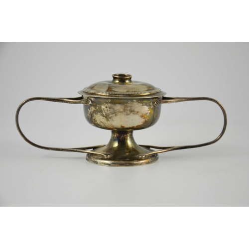 110 - An Arts and Crafts silver cigar burner, Goldsmiths and Silversmiths Company, London 1906, twin handl... 