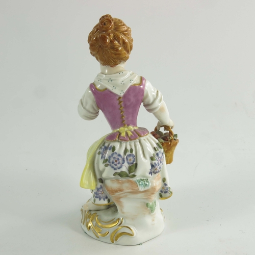 977 - A Meissen figure of an apple girl, after J J Kaendler, 20th century, modelled as a girl holding an a... 