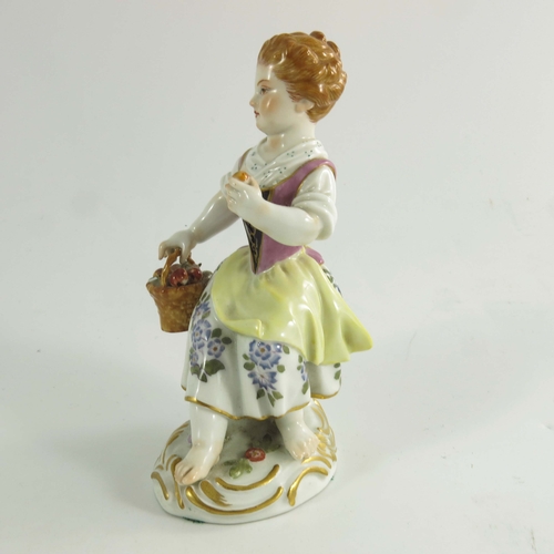 977 - A Meissen figure of an apple girl, after J J Kaendler, 20th century, modelled as a girl holding an a... 