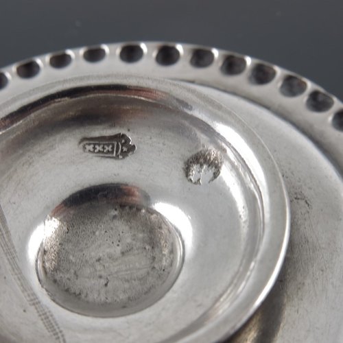 20 - An 18th century miniature Dutch tazza, Amsterdam circa 1730, circular form with embossed beaded bord... 