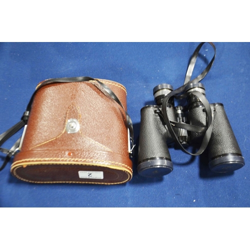 2 - A pair of Swift Saratoga 8 x 40 binoculars in leather case.